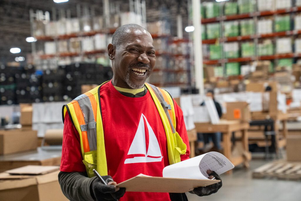 Man smiling with clipboard